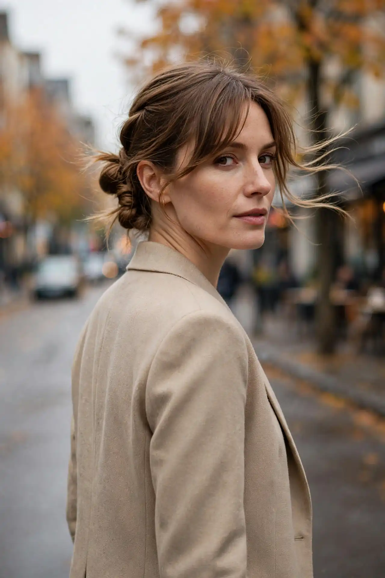 The Twisted Low Bun with a Side-Swept Fringe